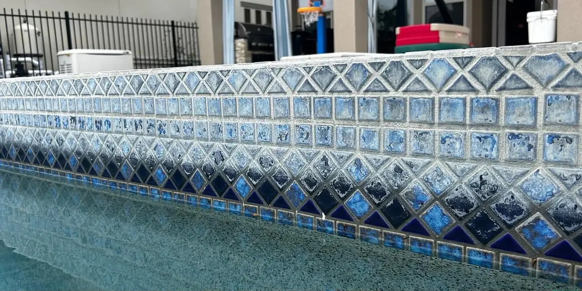 Before: Waterline tile calcium removal (project photo)